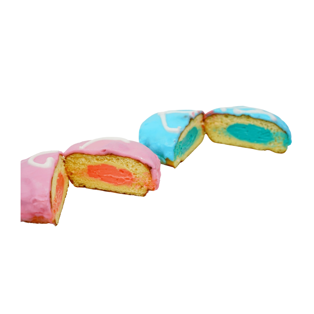 Pink and blue cream-filled gender reveal donuts